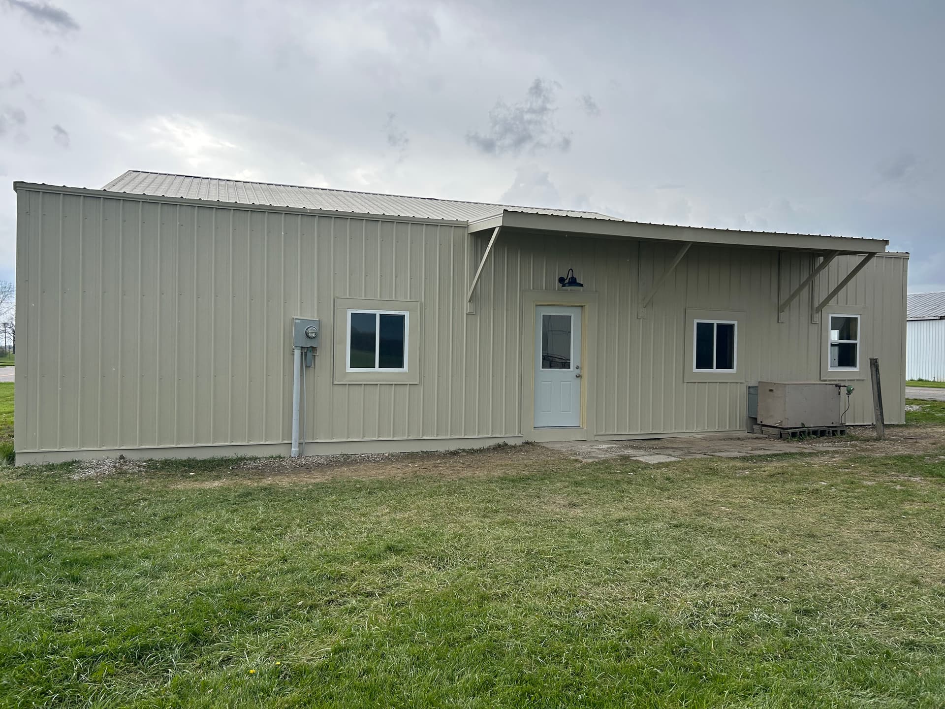 Gallery photos for Full exterior wall remodel with metal siding insulation and awning: Image #5