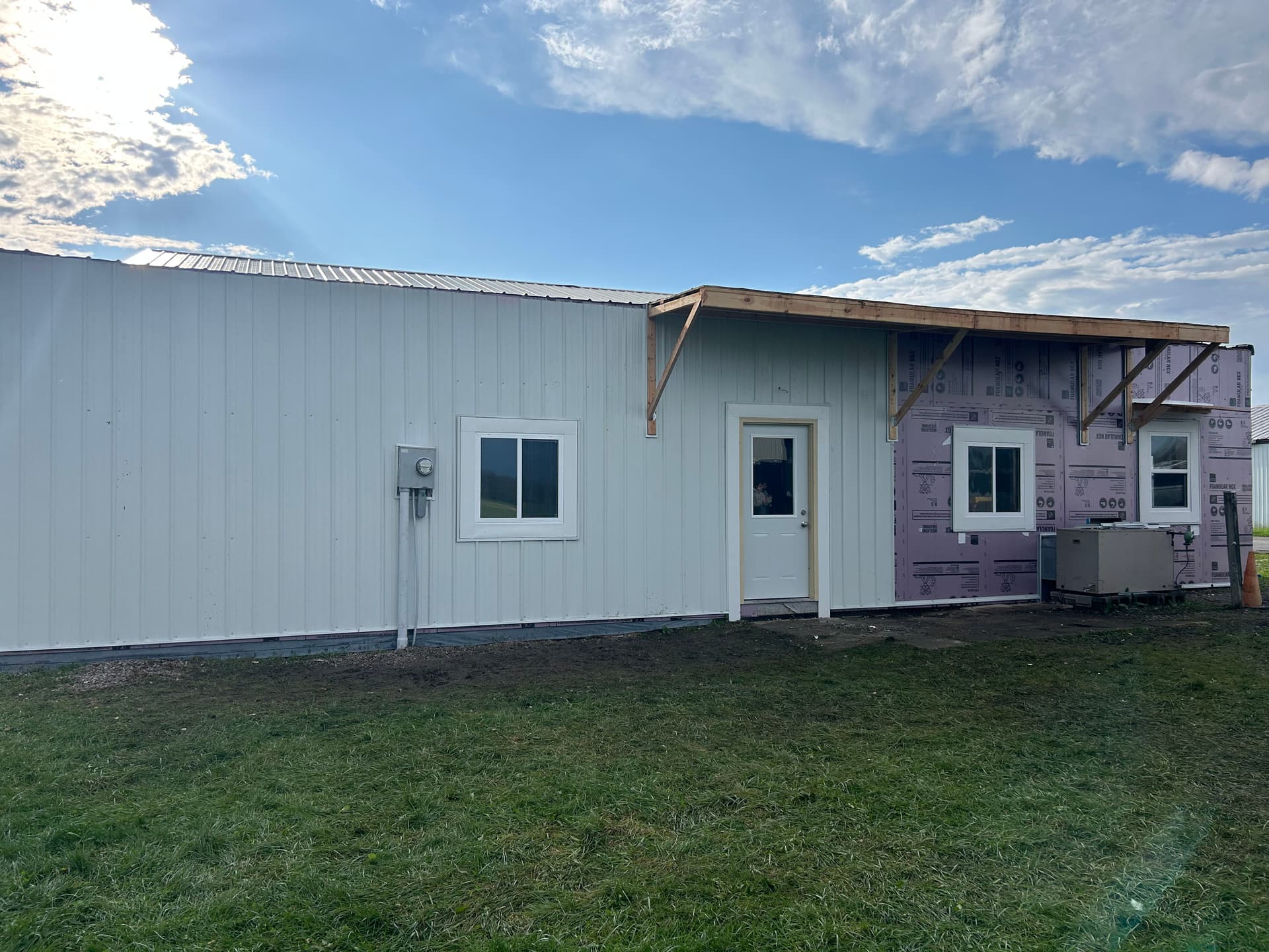 Gallery photos for Full exterior wall remodel with metal siding insulation and awning: Image #2