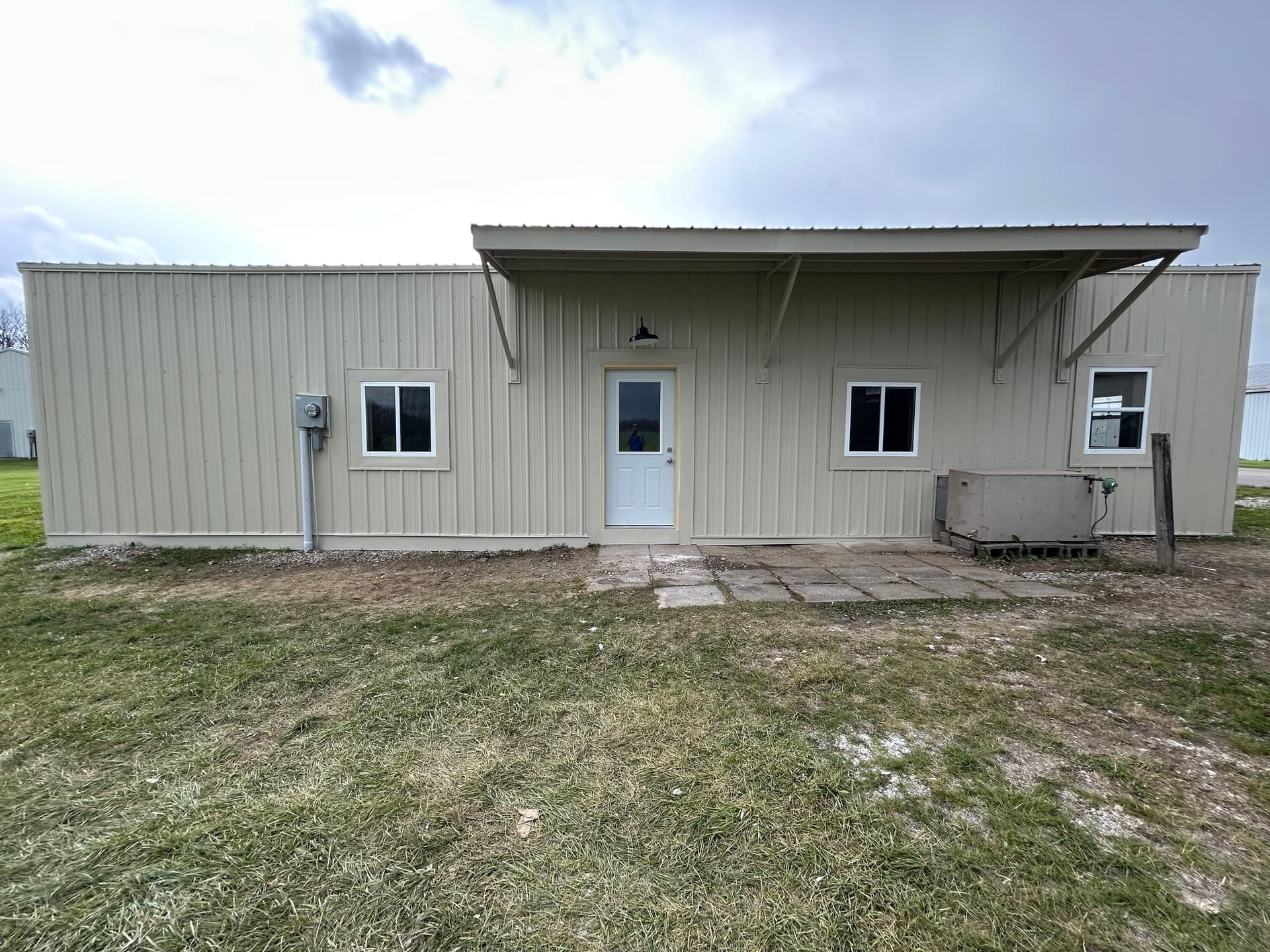 Gallery photos for Full exterior wall remodel with metal siding insulation and awning: Image #4