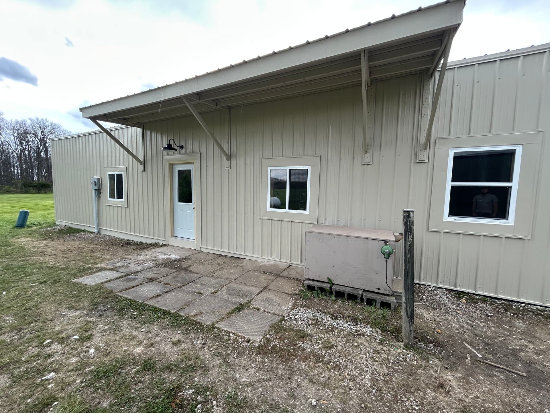 Gallery photos for Full exterior wall remodel with metal siding insulation and awning: Image #6